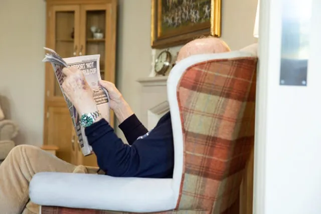 Man reading in a chair